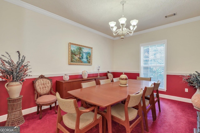 carpeted dining space featuring baseboards, visible vents, crown molding, and a chandelier
