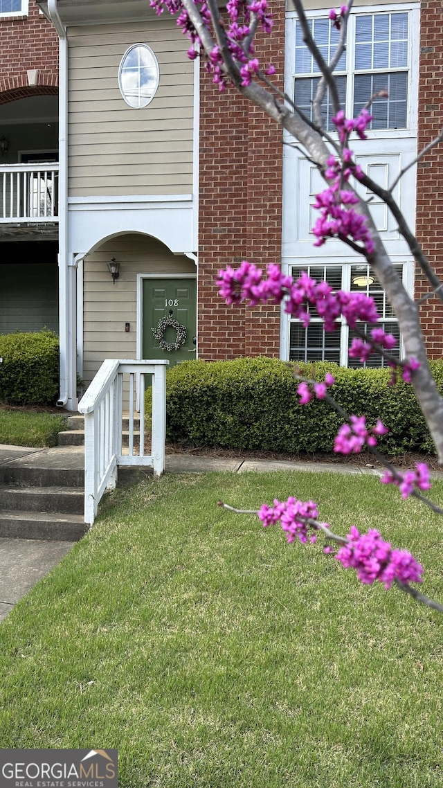 1731 Pryor Rd SW Unit 108, Atlanta, GA 30315 - property entrance featuring a lawn