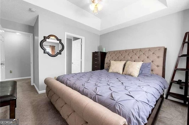 1731 Pryor Rd SW Unit 108, Atlanta, GA 30315 - bedroom featuring carpet flooring, baseboards, and a tray ceiling