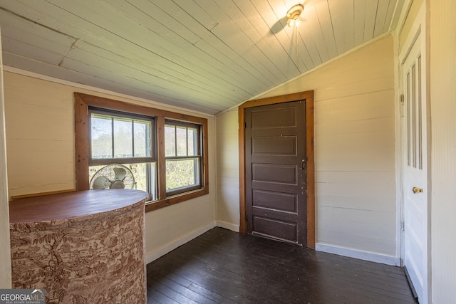 207 County Road 561, Woodland, AL 36280 - foyer entrance with dark wood-style flooring, wooden walls, baseboards, vaulted ceiling, and wood ceiling