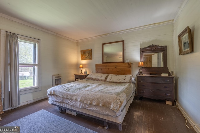 207 County Road 561, Woodland, AL 36280 - bedroom with baseboards, dark wood-style flooring, and heating unit