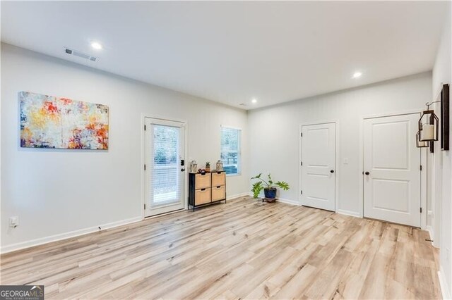 foyer with recessed lighting, visible vents, baseboards, and light wood-type flooring