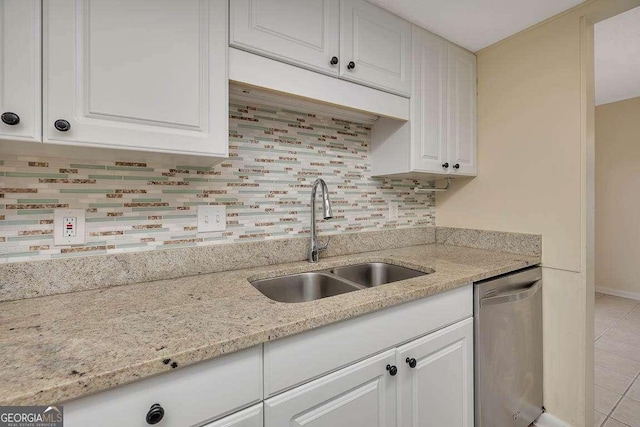 809 Mallery St Unit A, Saint Simons, GA 31522 - kitchen featuring dishwasher, white cabinetry, decorative backsplash, and light stone counters