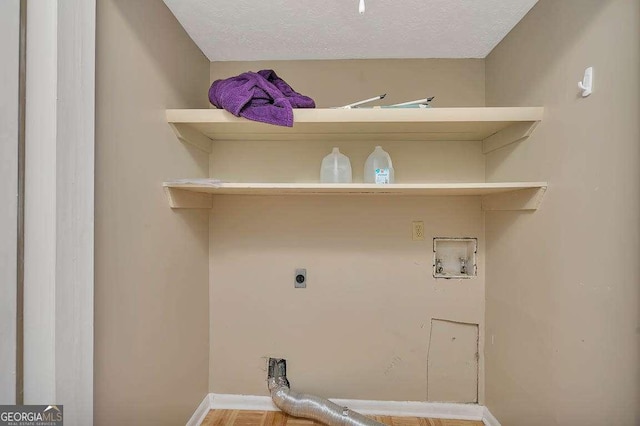 809 Mallery St Unit A, Saint Simons, GA 31522 - laundry area with hookup for an electric dryer, washer hookup, and a textured ceiling