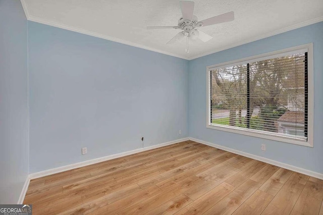 809 Mallery St Unit A, Saint Simons, GA 31522 - spare room with light wood finished floors, a ceiling fan, and ornamental molding