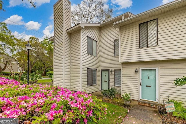 809 Mallery St Unit A, Saint Simons, GA 31522 - property entrance featuring a chimney