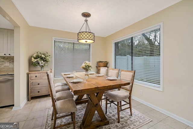 809 Mallery St Unit A, Saint Simons, GA 31522 - dining space with light tile patterned flooring and baseboards