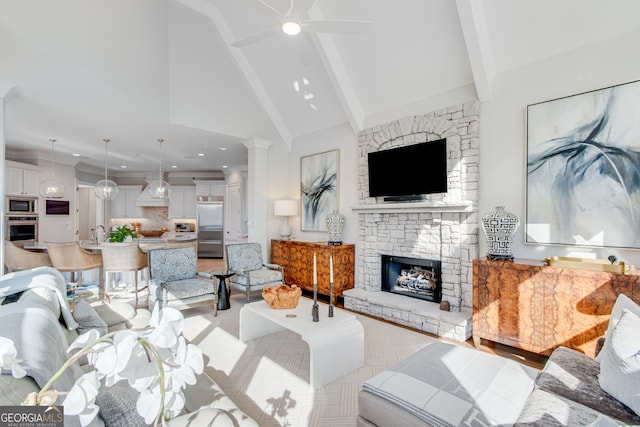 living room featuring high vaulted ceiling, beam ceiling, a ceiling fan, a stone fireplace, and recessed lighting