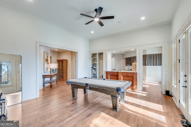 rec room with a healthy amount of sunlight, ornamental molding, light wood finished floors, ceiling fan, and pool table