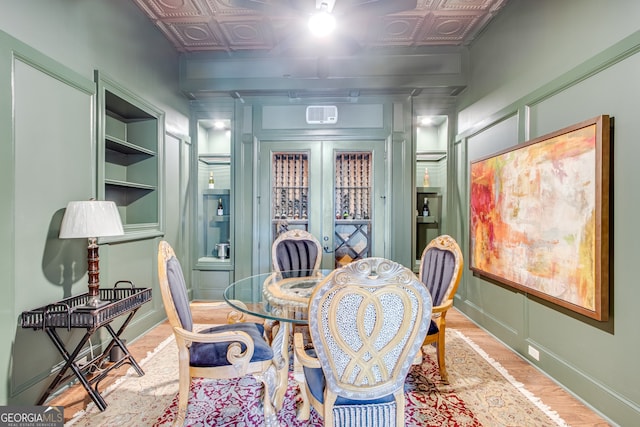 dining area with baseboards and an ornate ceiling