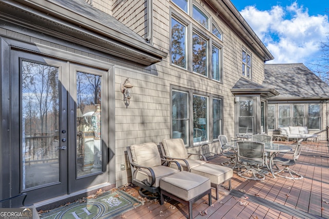 wooden terrace with outdoor dining area