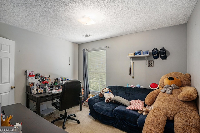 office space with visible vents, a textured ceiling, and light carpet