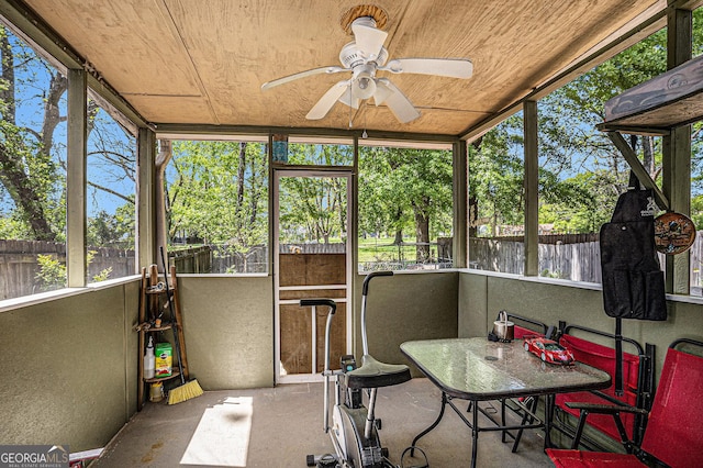 sunroom with ceiling fan and a wealth of natural light