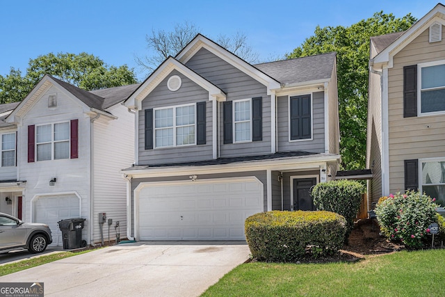 view of front of house with a garage and concrete driveway