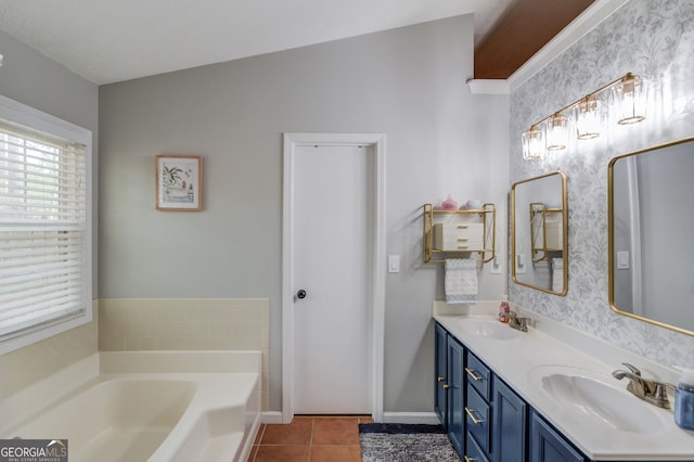 bathroom featuring a bath, tile patterned floors, a sink, and double vanity