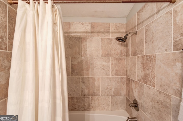 bathroom featuring shower / bathtub combination with curtain