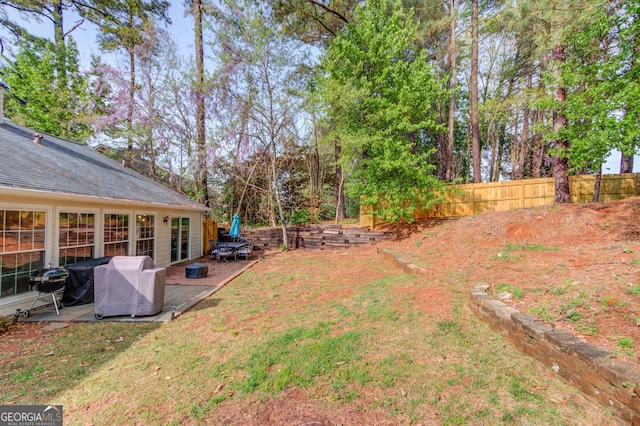 view of yard featuring a patio area and fence
