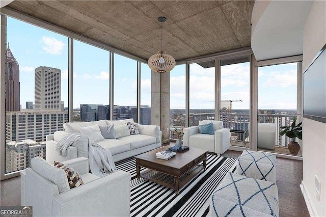 855 Peachtree St NE Unit 2403, Atlanta, GA 30308 - sunroom / solarium featuring floor to ceiling windows, plenty of natural light, wood finished floors, and a city view