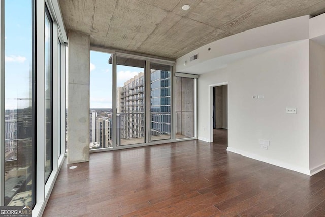 855 Peachtree St NE Unit 2403, Atlanta, GA 30308 - empty room featuring wood finished floors and floor to ceiling windows