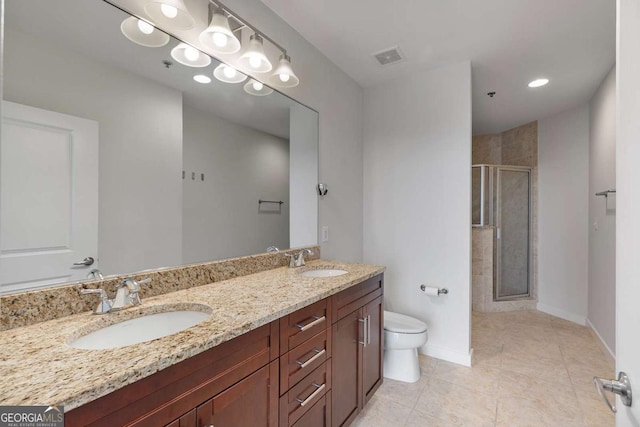 855 Peachtree St NE Unit 2403, Atlanta, GA 30308 - bathroom featuring a stall shower, double vanity, and tile patterned floors