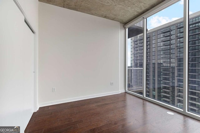 855 Peachtree St NE Unit 2403, Atlanta, GA 30308 - spare room featuring wood finished floors and baseboards