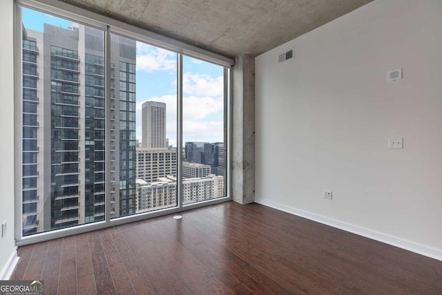855 Peachtree St NE Unit 2403, Atlanta, GA 30308 - spare room with expansive windows, wood finished floors, and a view of city