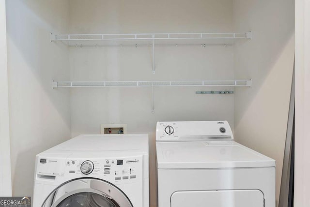 855 Peachtree St NE Unit 2403, Atlanta, GA 30308 - laundry area with washer and clothes dryer