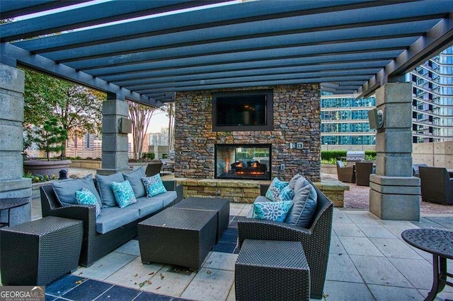 855 Peachtree St NE Unit 2403, Atlanta, GA 30308 - view of patio with an outdoor living space with a fireplace and a pergola