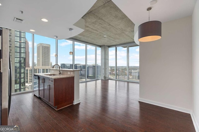 855 Peachtree St NE Unit 2403, Atlanta, GA 30308 - kitchen with expansive windows, dark wood-style flooring, a view of city, pendant lighting, and open floor plan