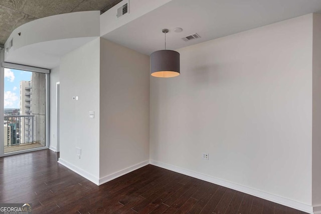 855 Peachtree St NE Unit 2403, Atlanta, GA 30308 - empty room featuring dark wood-type flooring and baseboards
