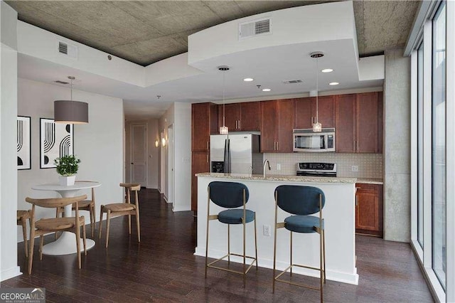 855 Peachtree St NE Unit 2403, Atlanta, GA 30308 - kitchen featuring stainless steel appliances, dark wood-style floors, tasteful backsplash, decorative light fixtures, and recessed lighting