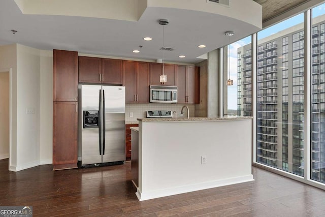 855 Peachtree St NE Unit 2403, Atlanta, GA 30308 - kitchen featuring stainless steel appliances, dark wood-style floors, tasteful backsplash, recessed lighting, and light stone countertops