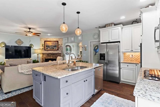 108 Summer Breeze Ln, Canton, GA 30114 - kitchen featuring stainless steel appliances, a sink, a ceiling fan, white cabinetry, and open floor plan