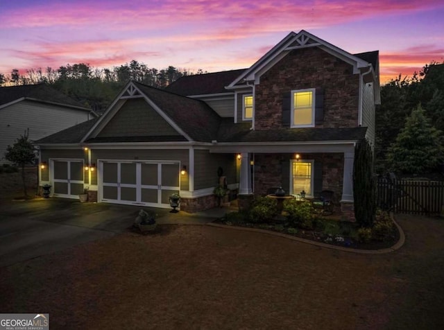108 Summer Breeze Ln, Canton, GA 30114 - craftsman-style home featuring stone siding, covered porch, a garage, concrete driveway, and fence