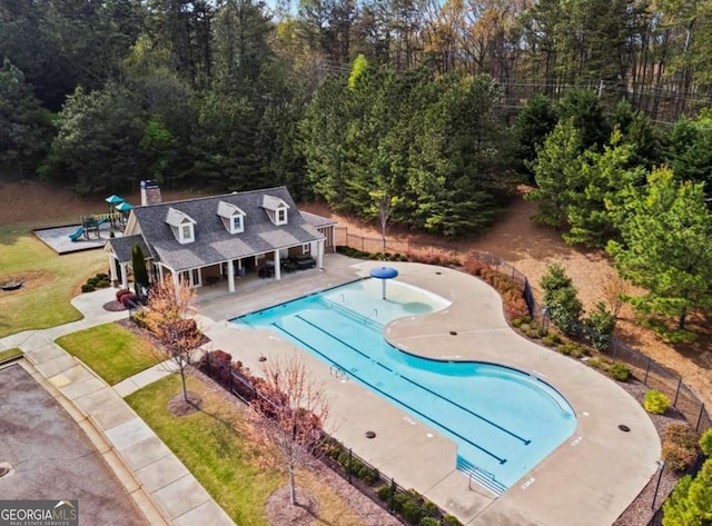 108 Summer Breeze Ln, Canton, GA 30114 - community pool with fence, a patio area, and an outbuilding