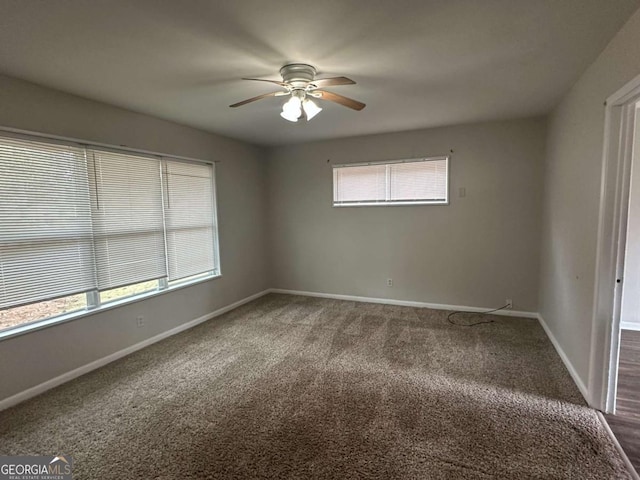 3025 Mckenzie Rd, Atlanta, GA 30344 - spare room with ceiling fan and dark carpet