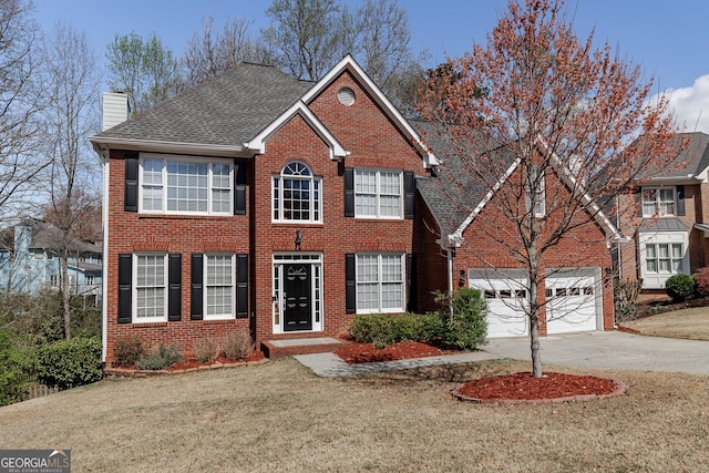 2032 Stonewick Ct, Lawrenceville, GA 30043 - colonial inspired home with a chimney, driveway, a front yard, and brick siding