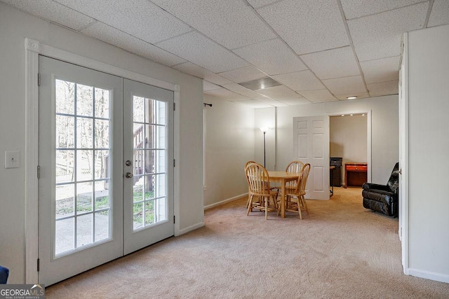 2032 Stonewick Ct, Lawrenceville, GA 30043 - carpeted dining space with french doors, healthy amount of natural light, and a drop ceiling