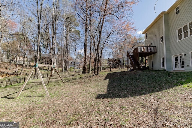 2032 Stonewick Ct, Lawrenceville, GA 30043 - view of yard featuring a wooden deck, french doors, stairway, and a playground