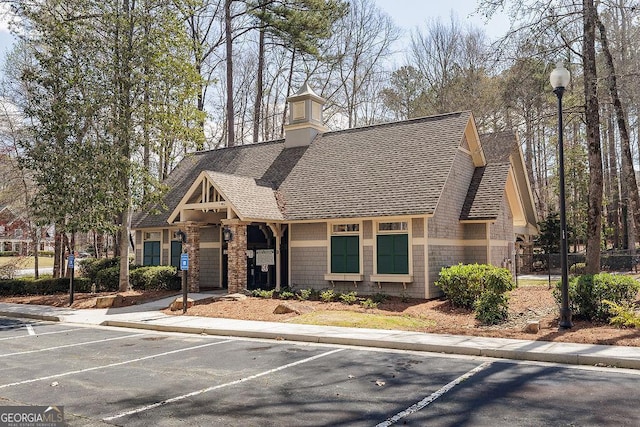 2032 Stonewick Ct, Lawrenceville, GA 30043 - view of front of house featuring a shingled roof and uncovered parking