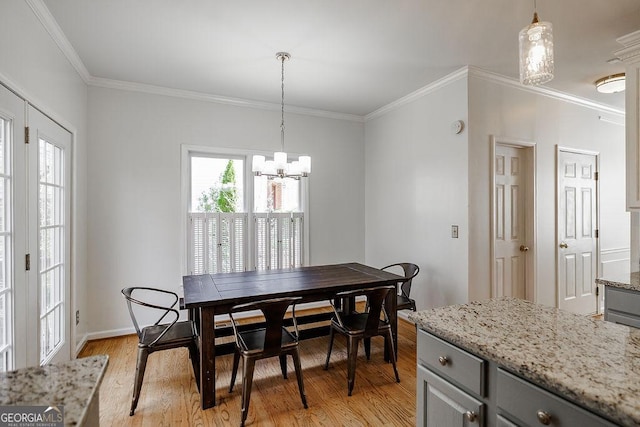 2032 Stonewick Ct, Lawrenceville, GA 30043 - dining space with a chandelier, light wood-style flooring, and ornamental molding