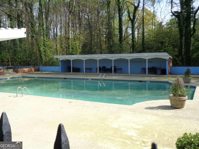 pool with a patio area