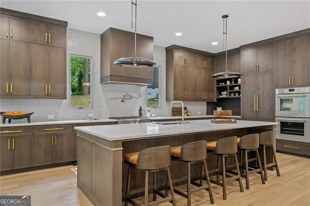 402 Chattahoochee St, Roswell, GA 30075 - kitchen with double oven, decorative backsplash, light wood-type flooring, and recessed lighting