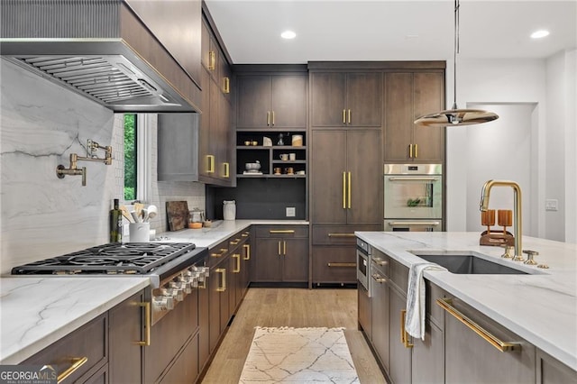 402 Chattahoochee St, Roswell, GA 30075 - kitchen with premium range hood, stainless steel appliances, light wood-style floors, light stone countertops, and recessed lighting