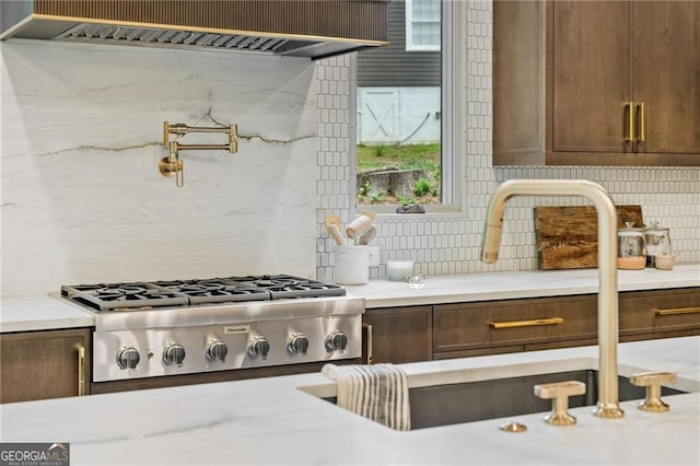 402 Chattahoochee St, Roswell, GA 30075 - kitchen featuring ventilation hood, backsplash, and stainless steel gas stovetop