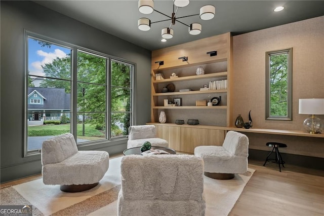 402 Chattahoochee St, Roswell, GA 30075 - sitting room featuring wood finished floors, a chandelier, built in shelves, and recessed lighting