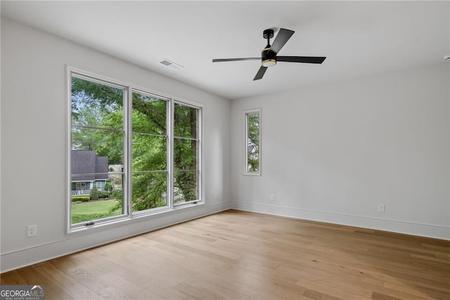 402 Chattahoochee St, Roswell, GA 30075 - empty room with light wood-style floors and ceiling fan