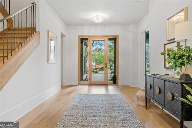402 Chattahoochee St, Roswell, GA 30075 - entrance foyer featuring stairs, light wood finished floors, and a chandelier