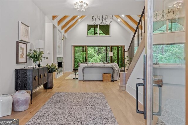 402 Chattahoochee St, Roswell, GA 30075 - entrance foyer featuring high vaulted ceiling, a chandelier, beamed ceiling, wood finished floors, and stairway