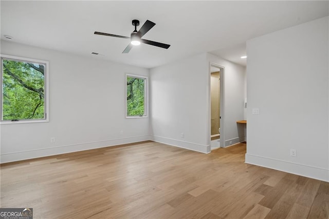 402 Chattahoochee St, Roswell, GA 30075 - spare room with light wood-type flooring, healthy amount of natural light, and ceiling fan